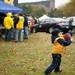 Indianapolis resident Henry Cooper, three, runs with a football before the game between Michigan and Illinois on Saturday. This is Henry's first football game. Daniel Brenner I AnnArbor.com